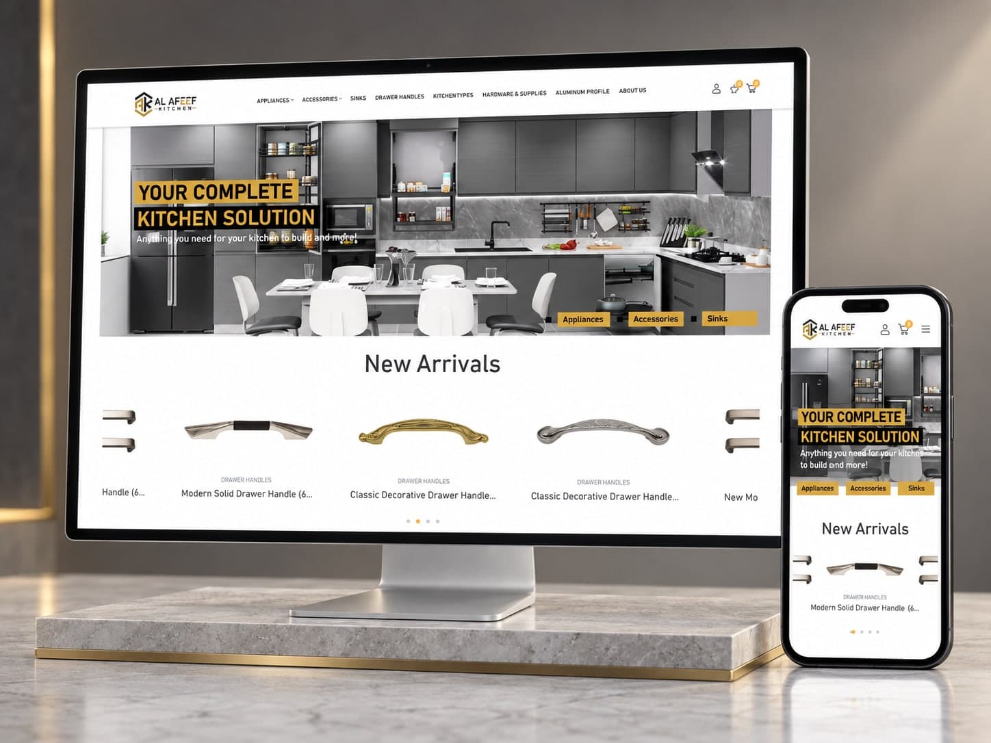 Al Afeef Kitchen online store on a desktop monitor and phone, showing a modern grey kitchen and new arrivals